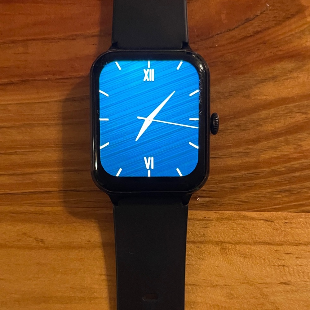 Sleek Black Smartwatch with Vibrant Multi-Face Display